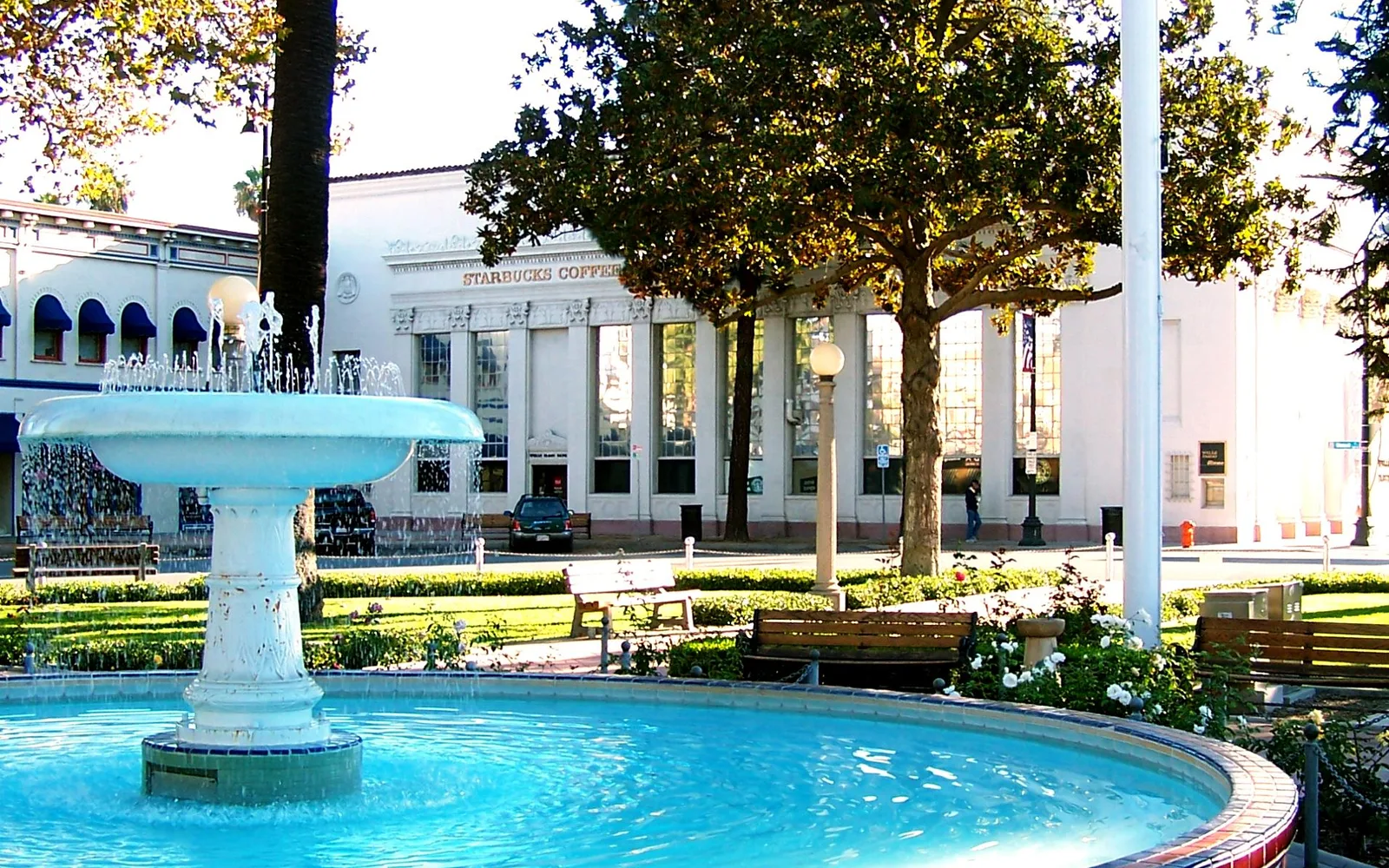 The fountain and plaza at the center of historic Old Towne Orange, surrounded by early twentieth-century storefronts and residential buildings